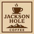 Jackson Hole Coffee logo with a coffee cup, steam, and mountain range illustration.